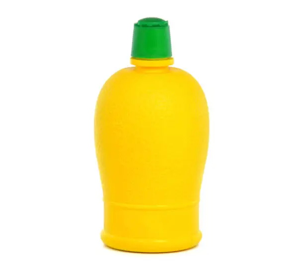 Bottle of lemon juice isolated on white background