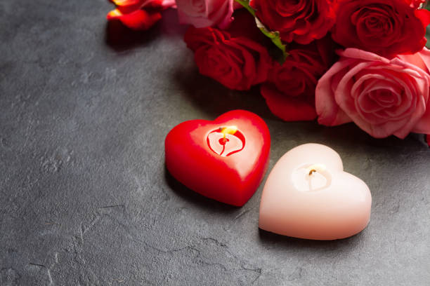 istock Rose flowers and heart candles 1361474934