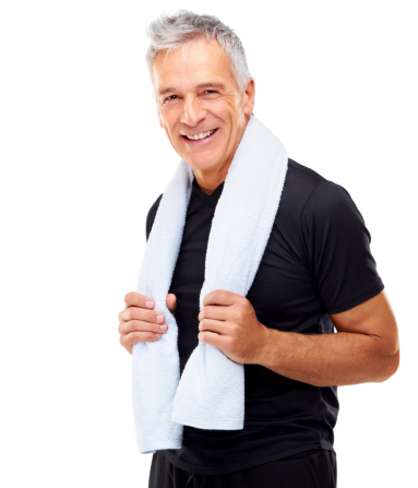 Portrait of a relaxed mature guy holding towel around his neck isolated on white background