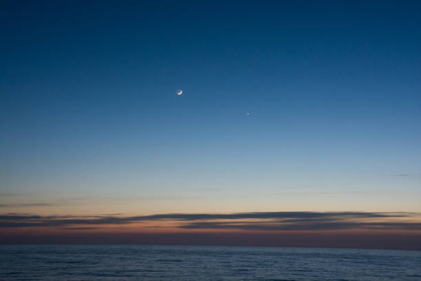 istock Crescent and Venus in the beautiful sea dusk sky 1361481911