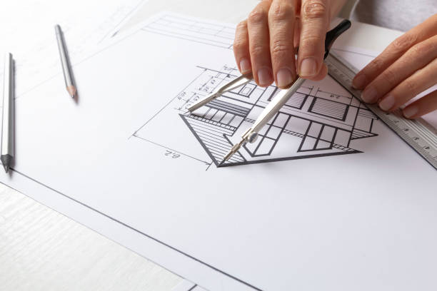 istock Architectural blueprints of a house on a designer's desktop. Blueprints. 1361483050