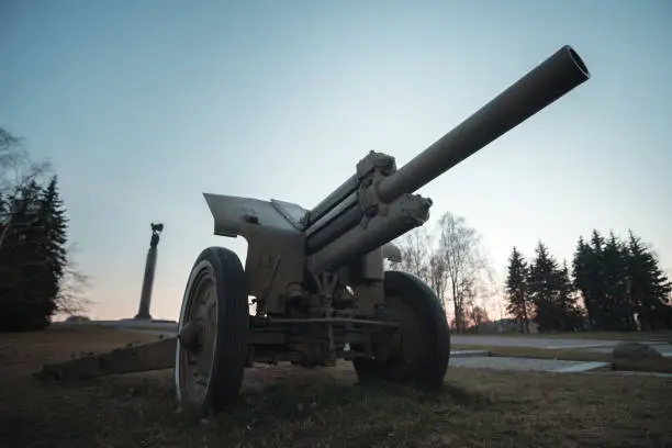 Photo of Soviet howitzer. Russian long-range artillery gun in position