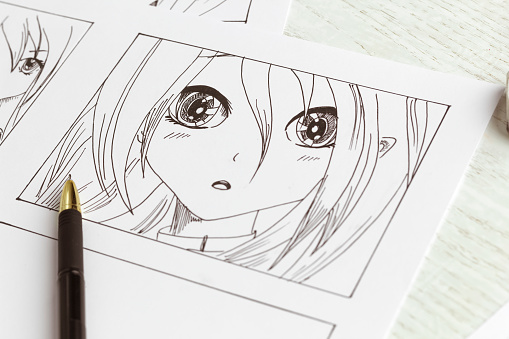 Dibujos de personajes de anime en el escritorio. Guión gráfico de cómics. Estilo manga. photo
