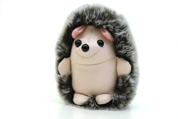 Fluffy funny toy hedgehog on white background, isolated
