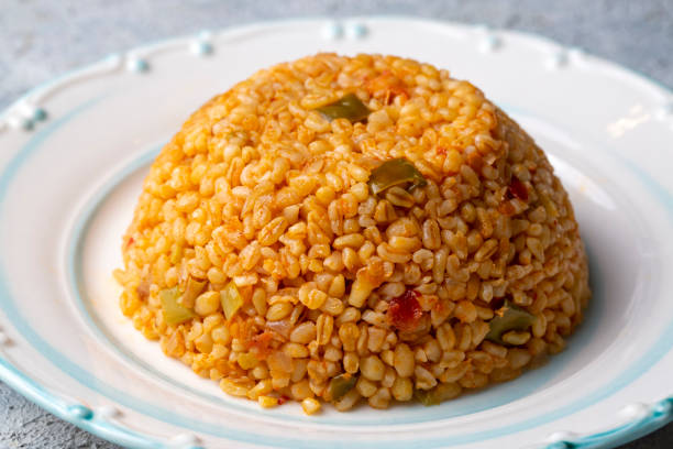 istock Traditional turkish bulgur pilaf with tomato sause in plate (Turkish name; meyhane pilavi) 1361487499
