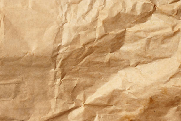 istock Crumpled kraft paper or cardboard texture for background 1361488437