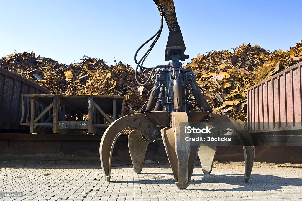 Scrap Heap Claw A huge mechanical claw, used to manipulate steel scrap on a scrapheap Alloy Stock Photo