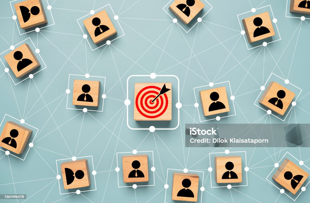 Red dartboard and black arrow connection linkage with human icon for customer focus target group and customer relation management concept. Customer Stock Photo