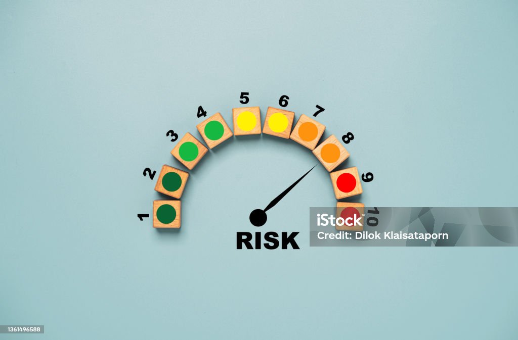 Risk level indicator rating print screen wooden cube block since low to high on blue background for Risk management and assessment concept. Danger Stock Photo