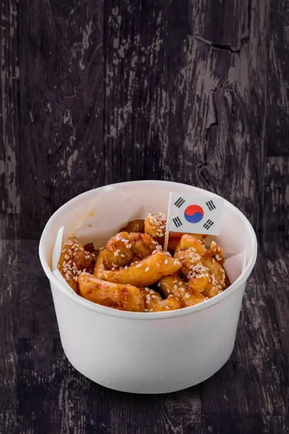 Fried Teokbokki Korea street food on dark table background