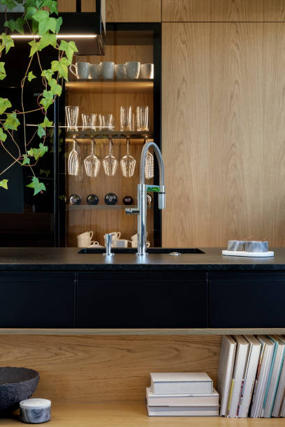 istock Minimalistic modern wooden panel kitchen interior with ergonomic biuld-in kitchen and kitchen island. Geometric forms and shapes. Details. Template. 