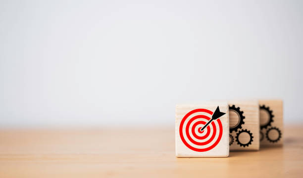istock Red dartboard with black arrow in front of mechanical gear for continuous do until achieve business objective target result. 1361505373