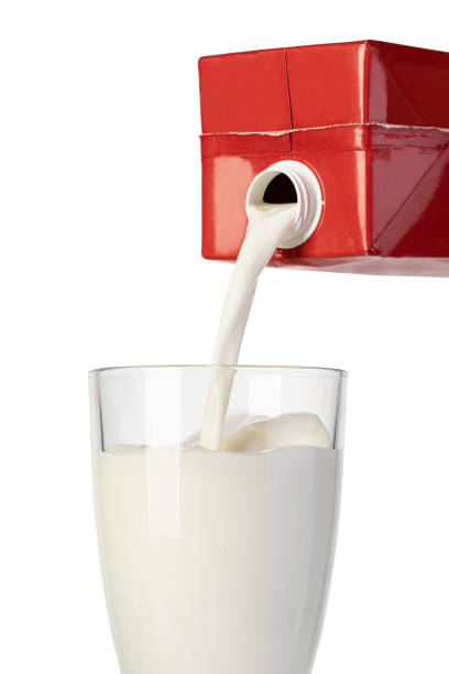 istock pouring milk from the carton into a glass 1361509357