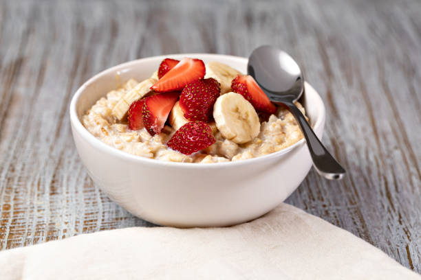 istock prepared oatmeal with fruits and berries 1361510395