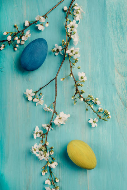 Easter Eggs Colorful easter eggs on blue wooden table. Retro filter. unusual basket stock pictures, royalty-free photos & images