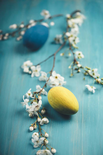 Easter Eggs Colorful easter eggs on blue wooden table. Retro filter. unusual basket stock pictures, royalty-free photos & images
