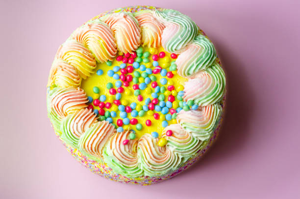 Slice of rainbow cake, food background.