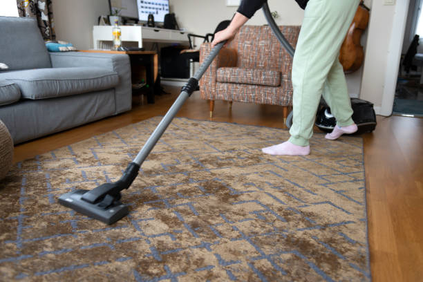 istock Woman vacuuming house 1361511287