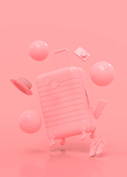 istock Colorful suitcase or baggage with beach accessories on monochrome pink background. 1361515213