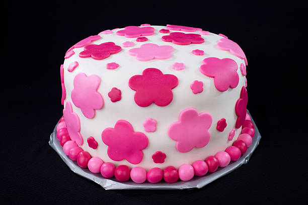 White Fondant Cake with Pink Flowers stock photo