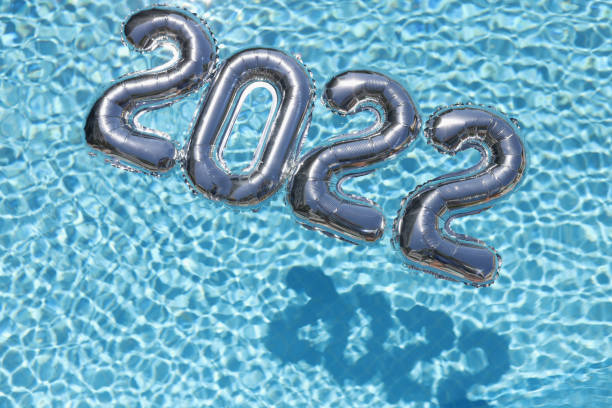 istock 2022 happy new year text. New year numbers on blue 1361515943