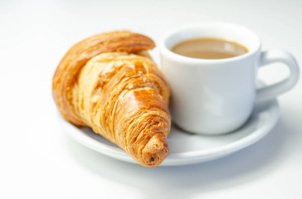 istock Croissant with chocolate on a plate with coffee in a cup 1361515974