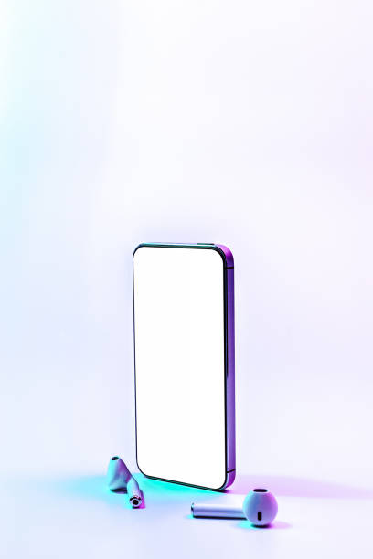istock Screen mockup. Mobile smartphone technology blank screen. Mock up smart phone device, audio headphones on neon gradient banner. Game design, mobile application presentation or portfolio mockups. 1361518602
