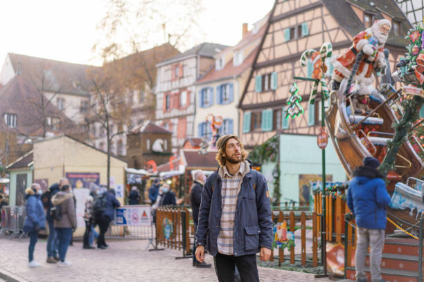istock Man walking in Colmar on Christmas 1361518609