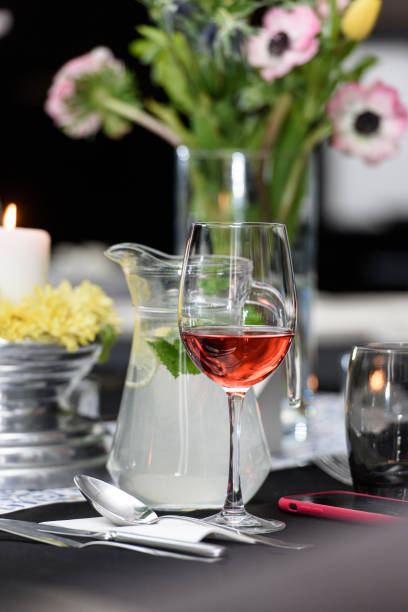 istock Glass of red wine on a served table in a restaurant 1361528477