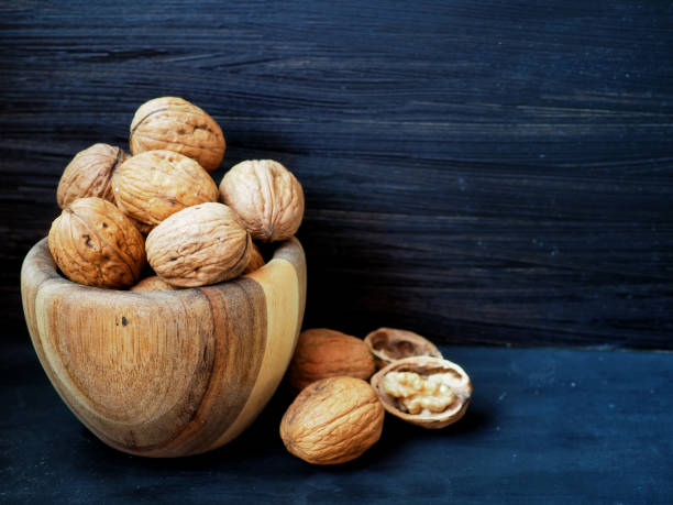 istock Walnuts in a wooden bowl 1361529549