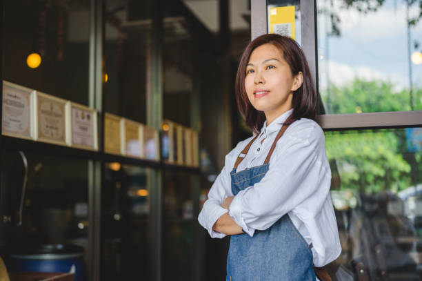 istock Female Cafe owner standing with crossed arms 1361543432