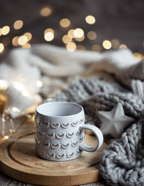 istock Beautiful Christmas cup on a blurred background with bokeh. 1361544003