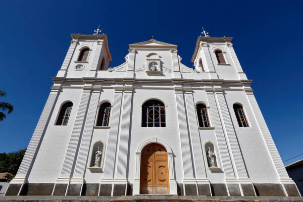 istock White catholic church under intense blue sky 1361544127