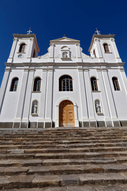 istock White catholic church under intense blue sky 1361544132