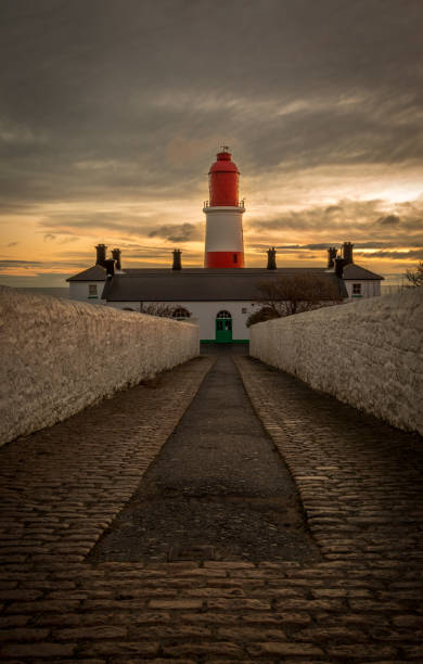 istock The pathway to the red and white striped, 23 meter tall,  Souter Lighthouse in Marsden, South Shields as the sun rises 1361544206