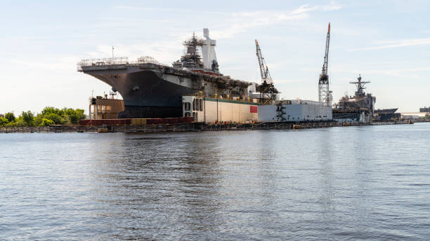 istock View on the navy shipyard with military ships under construction at Washington Point wharves, Norfolk, from waterfront of Portsmouth, Virginia. 1361546514
