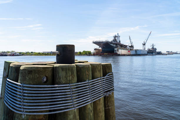 istock View on the navy shipyard with military ships under construction at Washington Point wharves, Norfolk, from waterfront of Portsmouth, Virginia. 1361546515