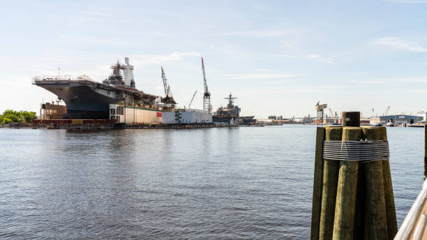 istock View on the navy shipyard with military ships under construction at Washington Point wharves, Norfolk, from waterfront of Portsmouth, Virginia. 1361546522