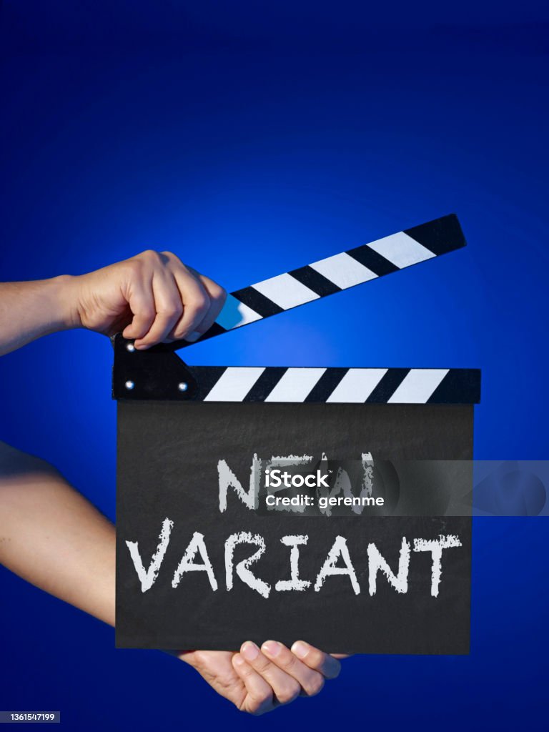 New variant Clapboard with “New variant” text on blue background. Clapboard Stock Photo