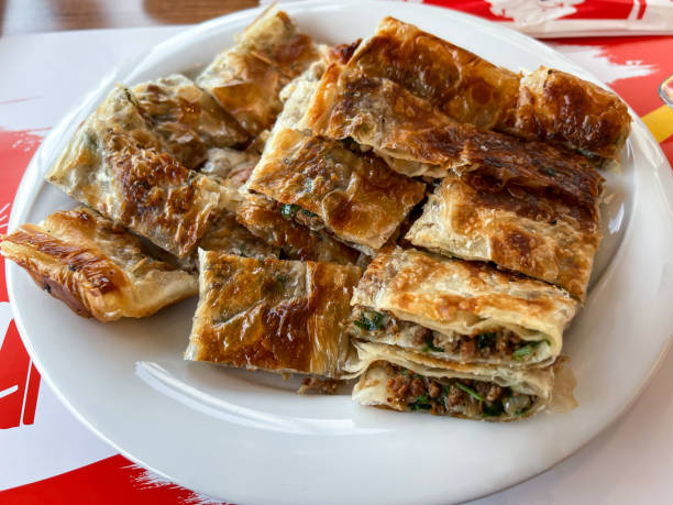 Antalya Turkey traditional handmade spread pastry.  Turkish name Serpme Borek stock photo