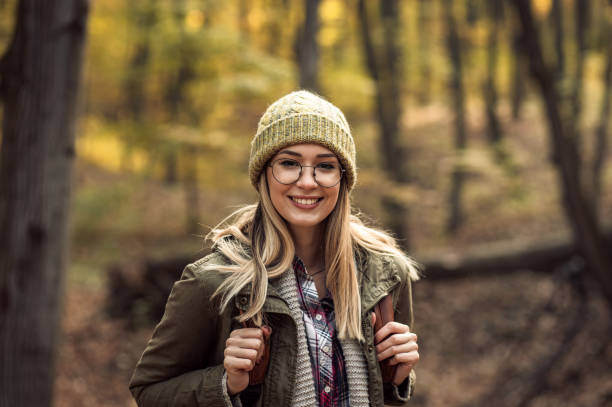istock Young women enjoying hiking in forest. 1361551127