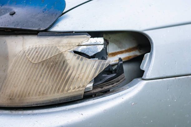 istock Broken headlight of a car after a minor accident 1361553780