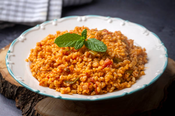 istock Traditional turkish bulgur pilaf with tomato sause in plate (Turkish name; meyhane pilavi) 1361559791