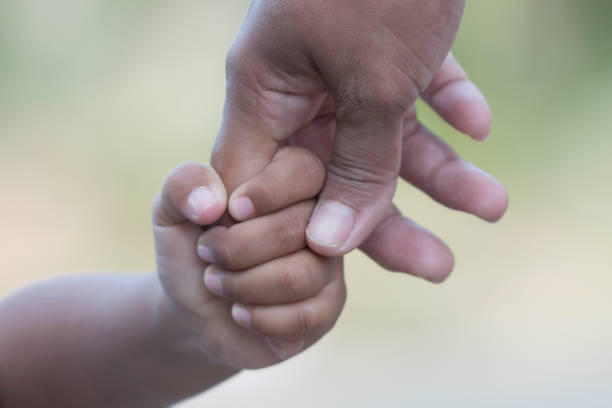 istock Mother's and a child hands 1361561346