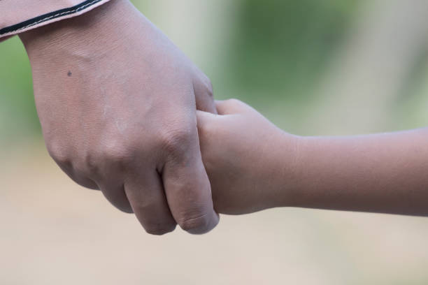 istock Mother's and a child hands 1361561399