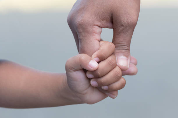 istock Mother's and a child hands 1361562015