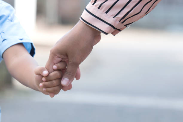 istock Mother's and a child hands 1361562082