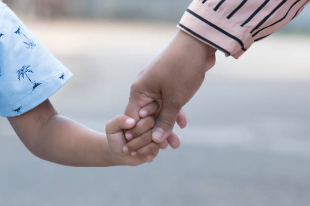 istock Mother's and a child hands 1361562107