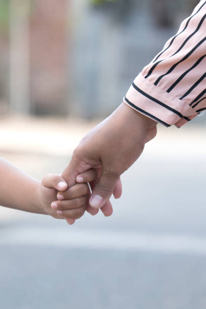 istock Mother's and a child hands 1361562144