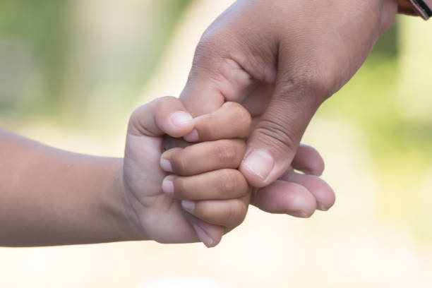 istock Mother's and a child hands 1361562158
